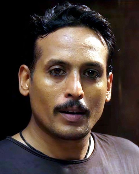 Sujith Shanker with a moustache in a dark T-shirt, portrait