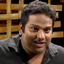 Vipin Atley smiling in a black shirt, close-up portrait