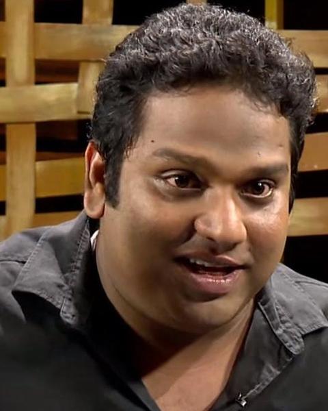 Vipin Atley smiling in a black shirt, close-up portrait