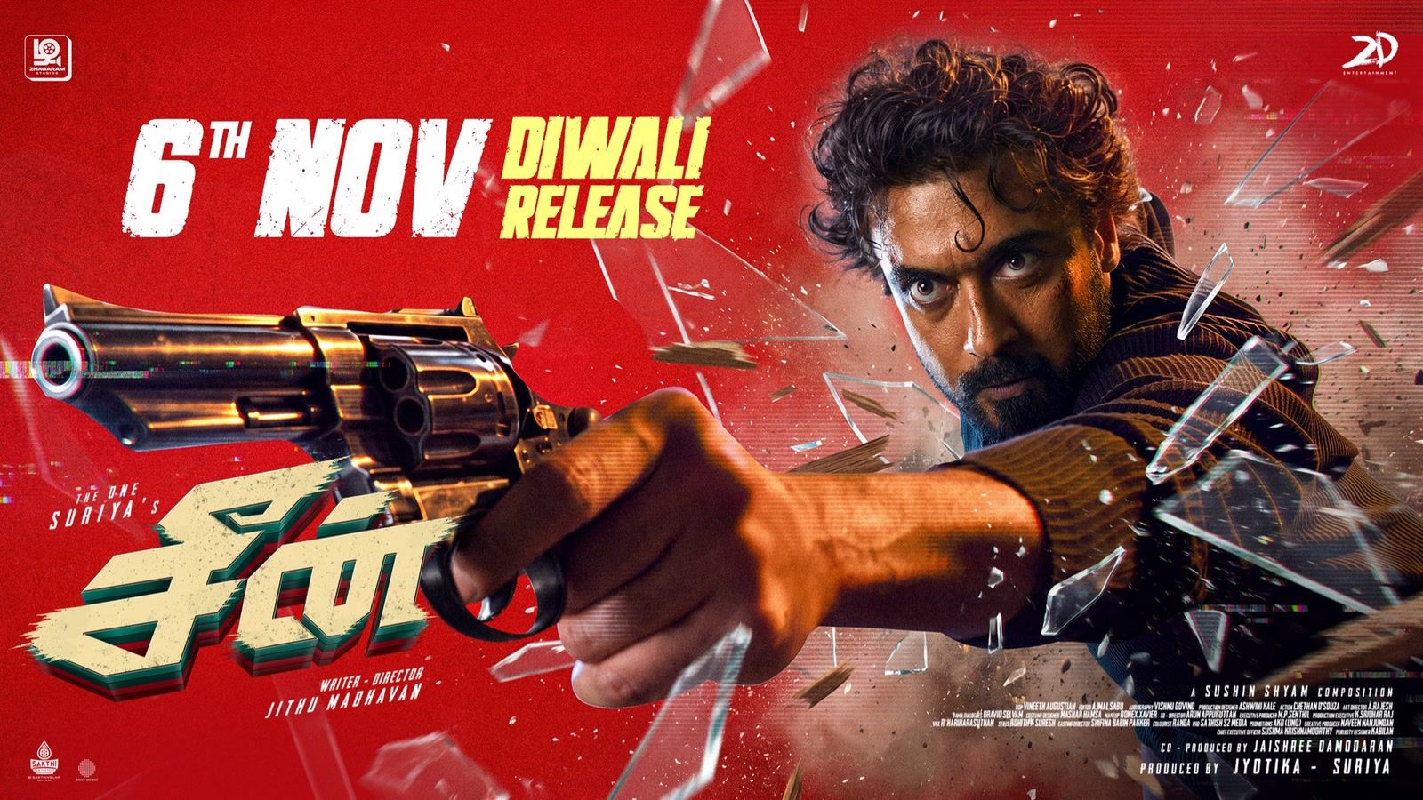 Suriya aiming a revolver through shattering glass in the Scene Diwali release poster