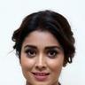 Shriya Saran smiling with her hair tied back, close-up portrait