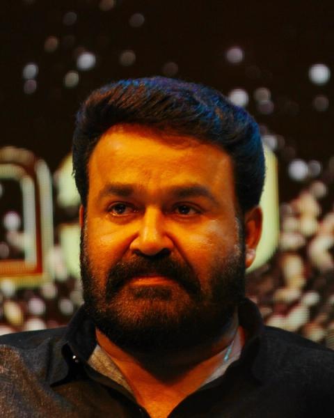 Mohanlal with a beard in a dark shirt at an event