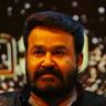 Mohanlal with a beard in a dark shirt at an event