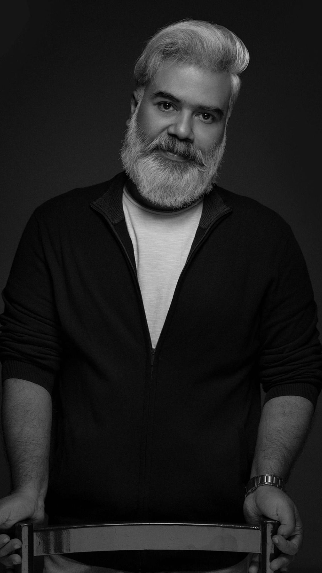 Ranjan Pramod with a grey beard in a dark shirt, black and white