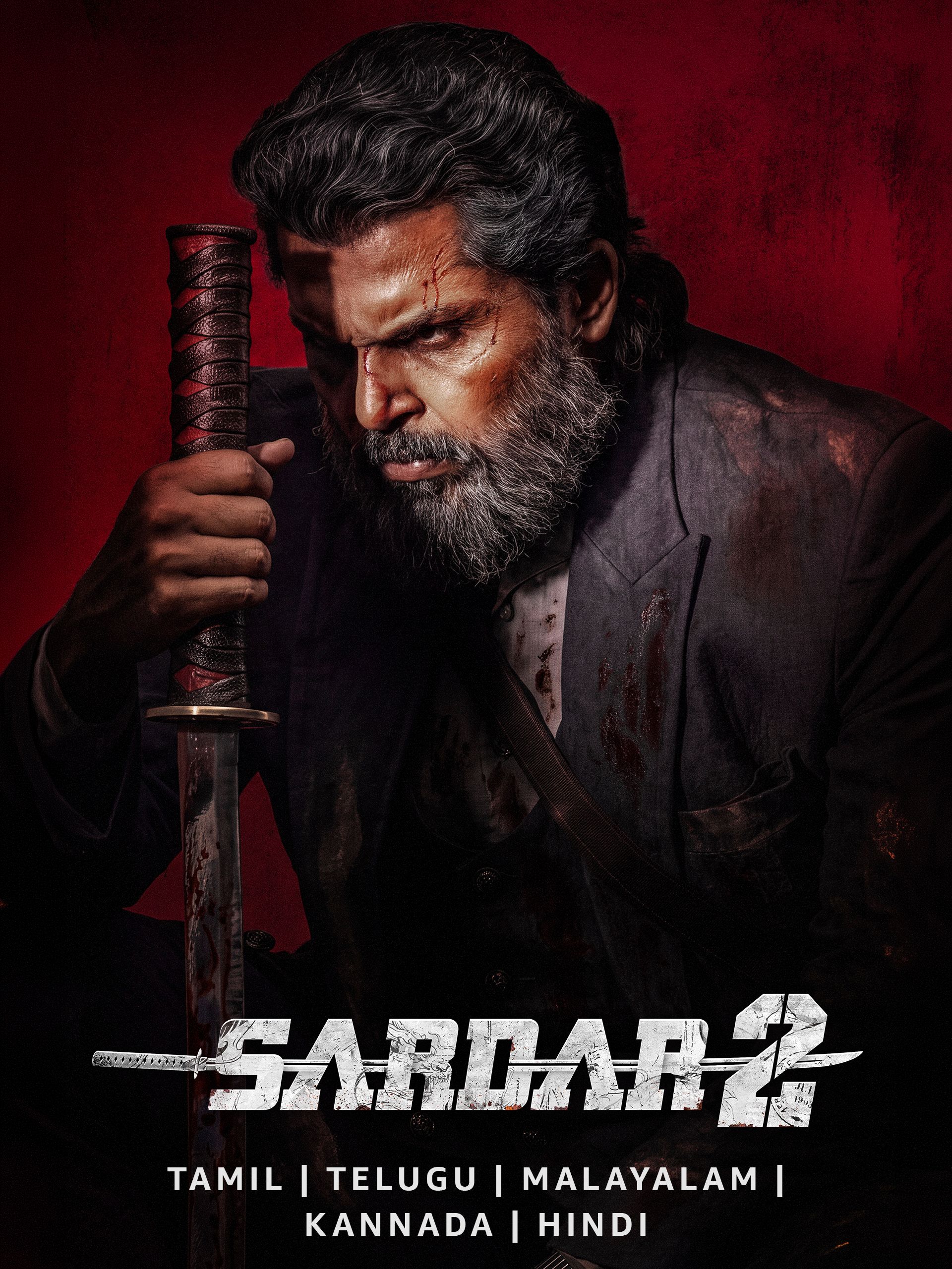 Sardar 2 poster with a grey-bearded Karthi gripping a sword in red light
