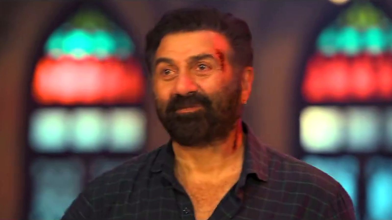 Sunny Deol, with a cut on his forehead, in front of stained-glass windows in the Suryaa: Ant Se Aarambh Tak teaser.