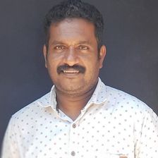 Kiran Peethambaran in a white printed shirt outdoors, portrait