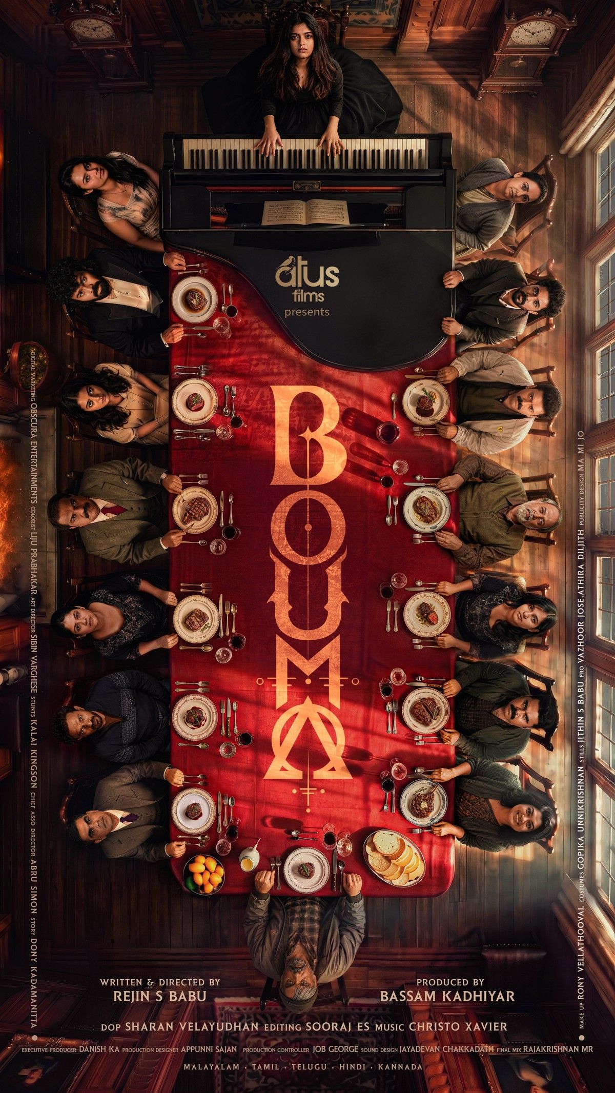 Bouma first-look poster, an overhead view of 16 family members seated around a long red dining table with a grand piano at its head