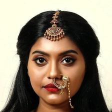 Sruthy Jayan in bridal jewellery with a nose ring, portrait