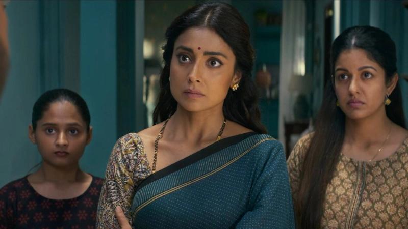 Shriya Saran and Ishita Dutta with a young girl in a still from Drishyam: The Conclusion