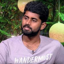 Kathir in a lavender T-shirt, head-and-shoulders portrait