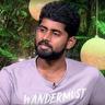 Kathir in a lavender T-shirt, head-and-shoulders portrait