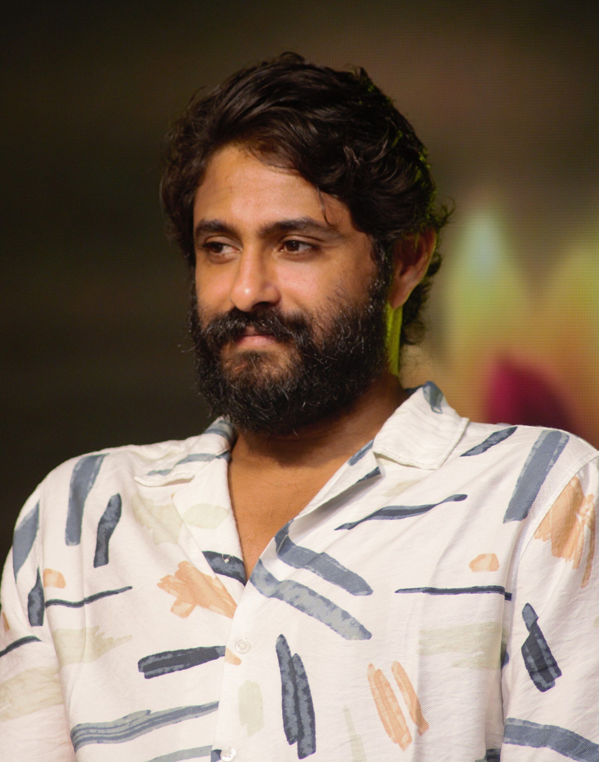 Antony Varghese in a white patterned shirt, half-length portrait