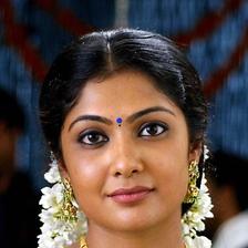 Kamalinee Mukherjee in traditional gold jewellery and jasmine flowers, portrait