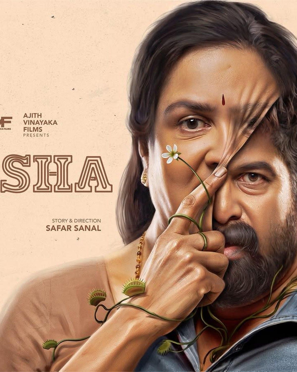Aasha poster with Urvashi and Joju George, a thorny branch across their faces