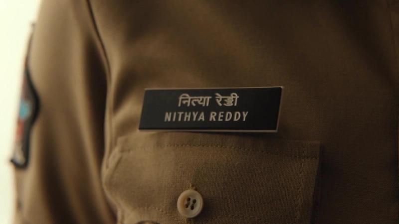Nithya Reddy police name badge from the OM glimpse
