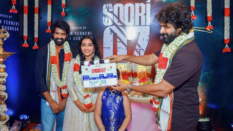 Soori and Rajisha Vijayan with the clapboard at the Soori 7 pooja in Chennai