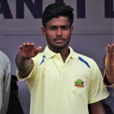 Sanju Samson smiling in a portrait photo