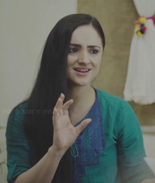 Paris Laxmi in a green top gesturing as she speaks