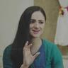 Paris Laxmi in a green top gesturing as she speaks