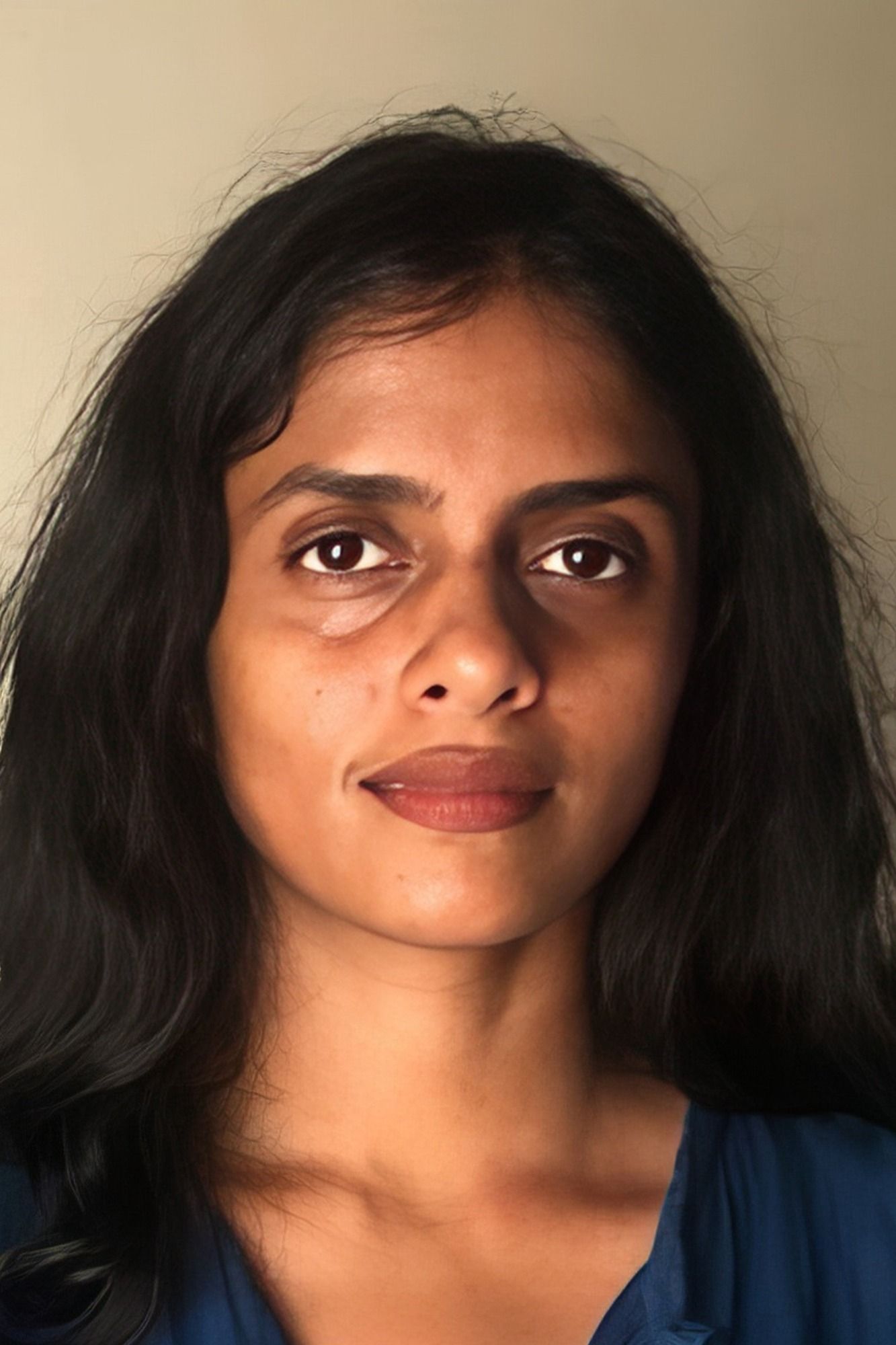 Kani Kusruti with long dark hair, close-up portrait