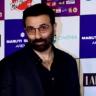 Sunny Deol in tinted glasses at an awards event