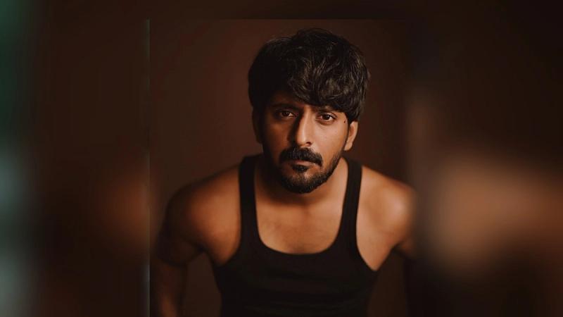 Prabhu Muralikrishna in a black vest, looking at the camera