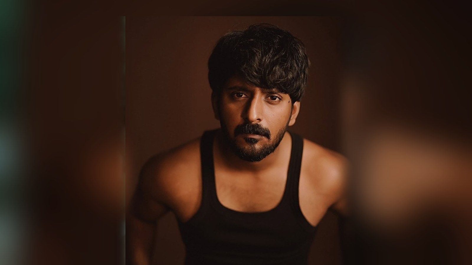 Prabhu Muralikrishna in a black vest, looking at the camera