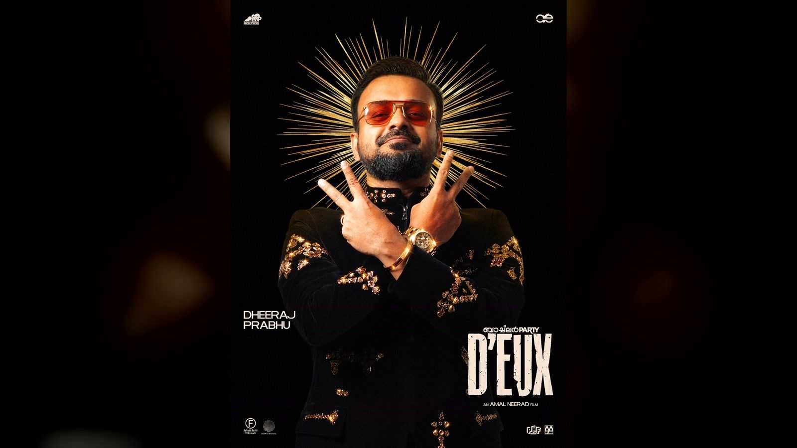 Kunchacko Boban as Dheeraj Prabhu, in sunglasses and a gold halo, on the Bachelor Party D'eux character poster