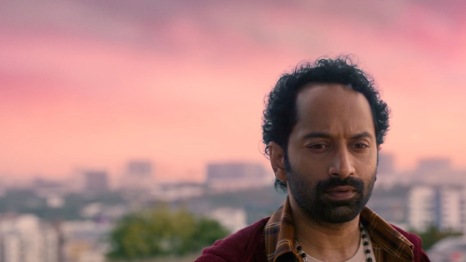 Fahadh Faasil as Suri against a pink evening sky over the city in the Don't Trouble the Trouble trailer