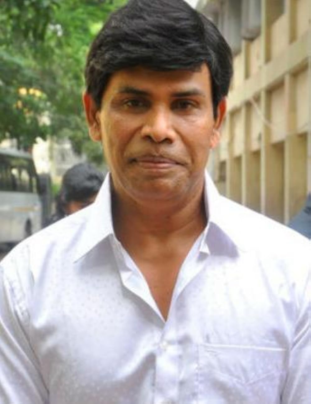 Anandaraj in a white shirt, portrait