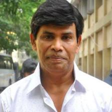 Anandaraj in a white shirt, portrait