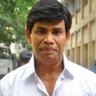 Anandaraj in a white shirt, portrait