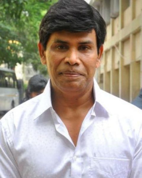 Anandaraj in a white shirt, portrait