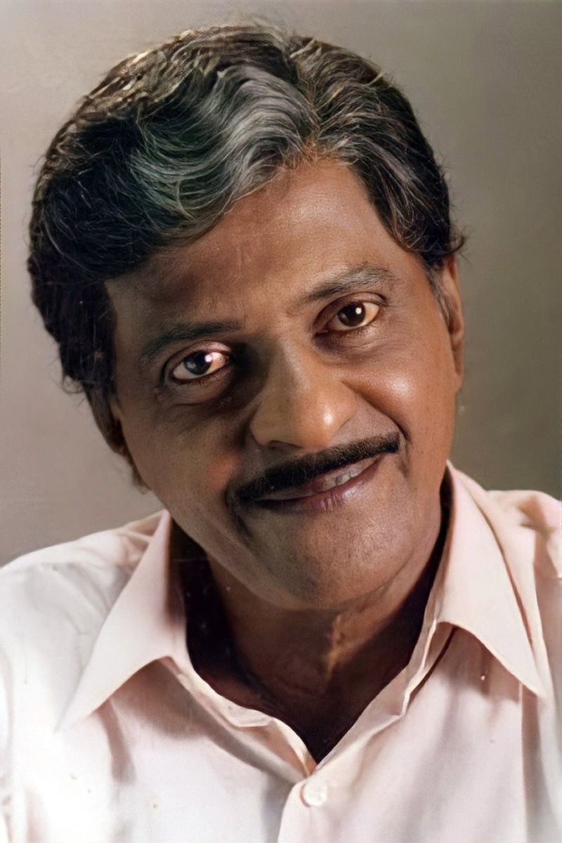 Kuthiravattam Pappu smiling in a light shirt, close-up portrait