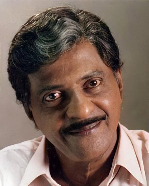 Kuthiravattam Pappu smiling in a light shirt, close-up portrait
