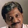 Kuthiravattam Pappu smiling in a light shirt, close-up portrait