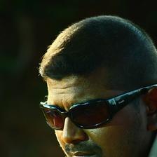 Mysskin in dark sunglasses, close-up side portrait