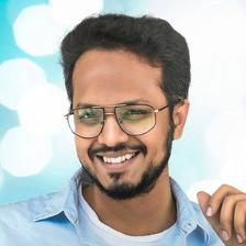Rahul Sankrityan wearing glasses, front-facing portrait