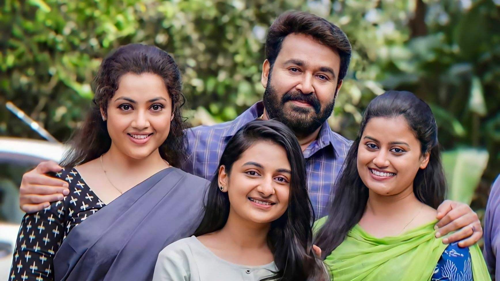 Drishyam 2 still of Mohanlal with Meena and their two daughters smiling together