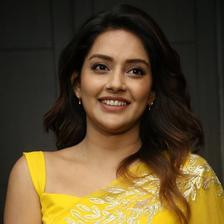 Mahima Nambiar smiling in a yellow outfit, half-length portrait
