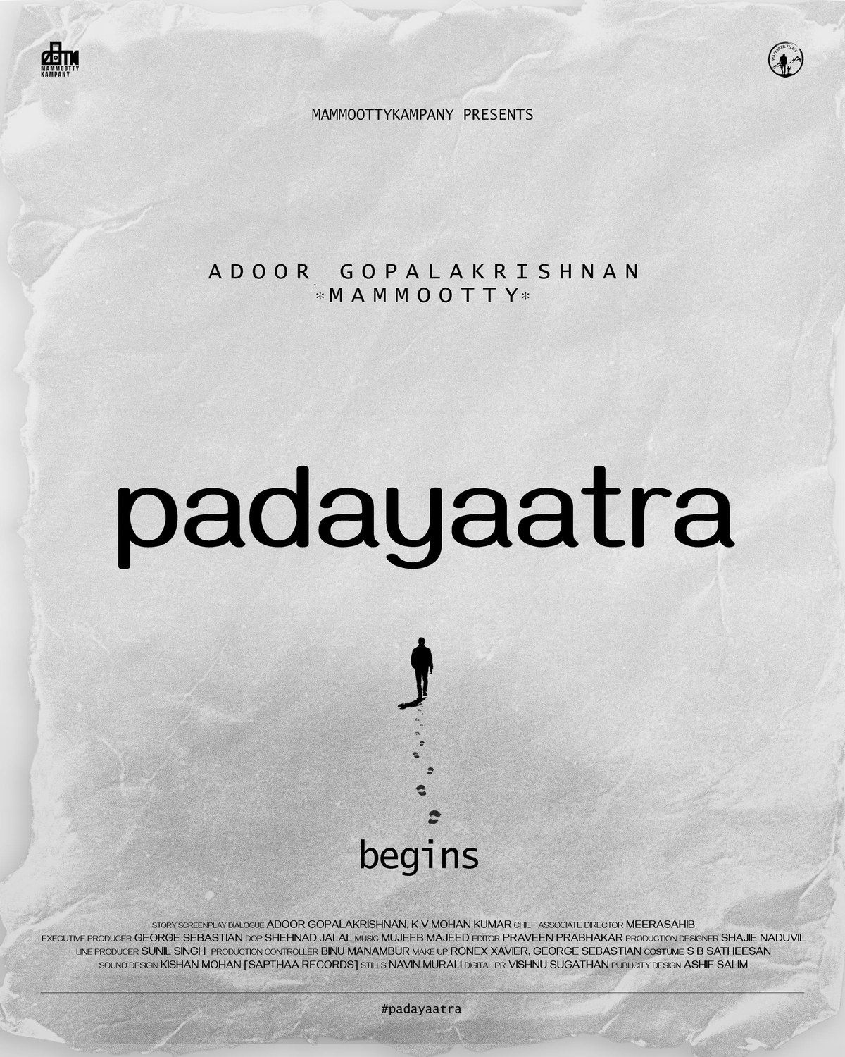 Padayaatra title poster with the film's name in black on crumpled white paper, the names Adoor Gopalakrishnan and Mammootty above it, and a lone man walking away below, leaving a trail of footprints