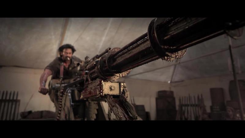 Prabhas, bearded and bloodied, firing a mounted gun inside a tent in the Fauzi teaser