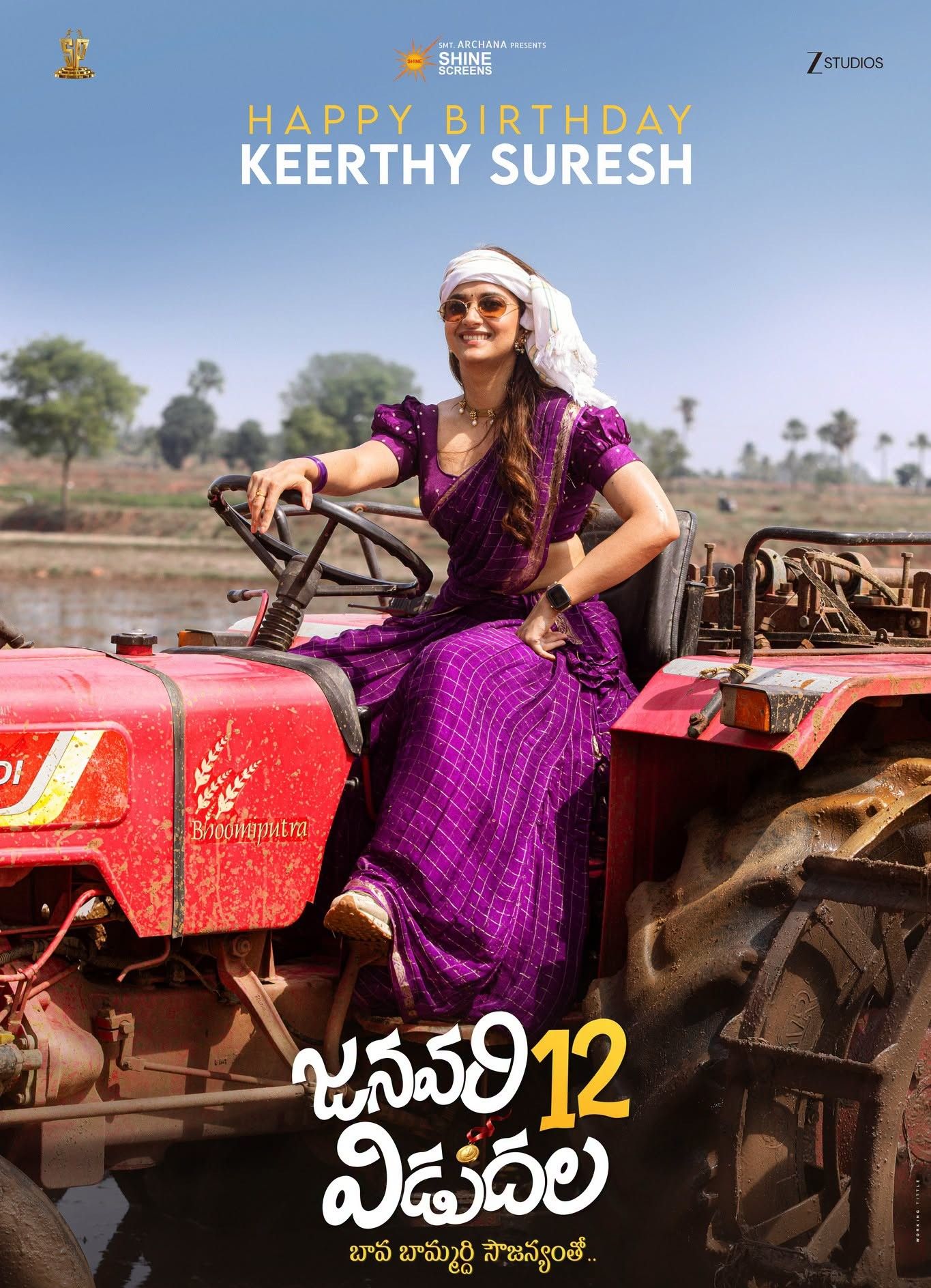 January 12 Vidudala poster showing Keerthy Suresh in a purple sari and sunglasses seated on a red tractor in a paddy field