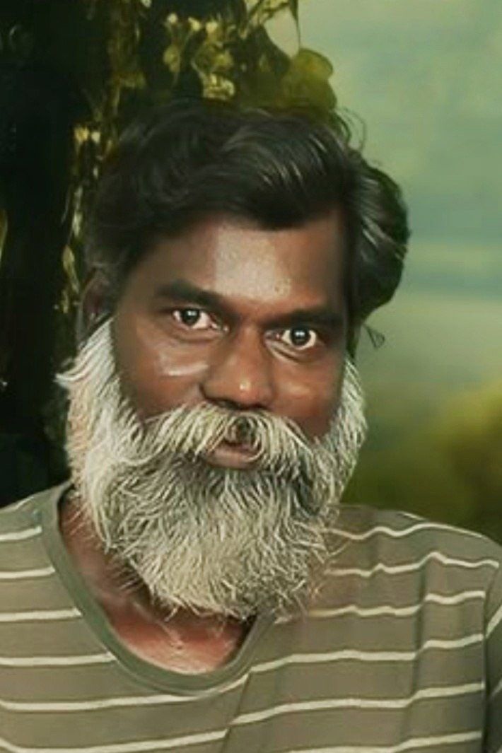 Rajan Poothrakkal with a long white beard, close-up portrait
