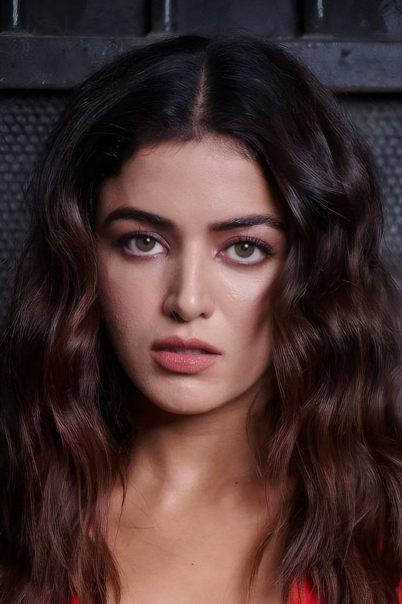 Wamiqa Gabbi with long wavy hair looking at the camera, close-up