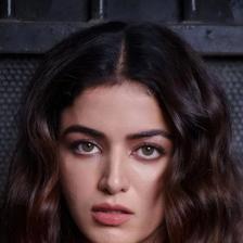 Wamiqa Gabbi with long wavy hair looking at the camera, close-up