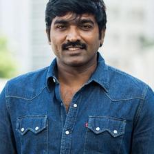 Vijay Sethupathi in a denim shirt outdoors, half-length portrait