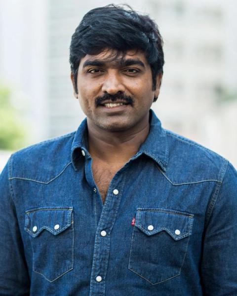 Vijay Sethupathi in a denim shirt outdoors, half-length portrait
