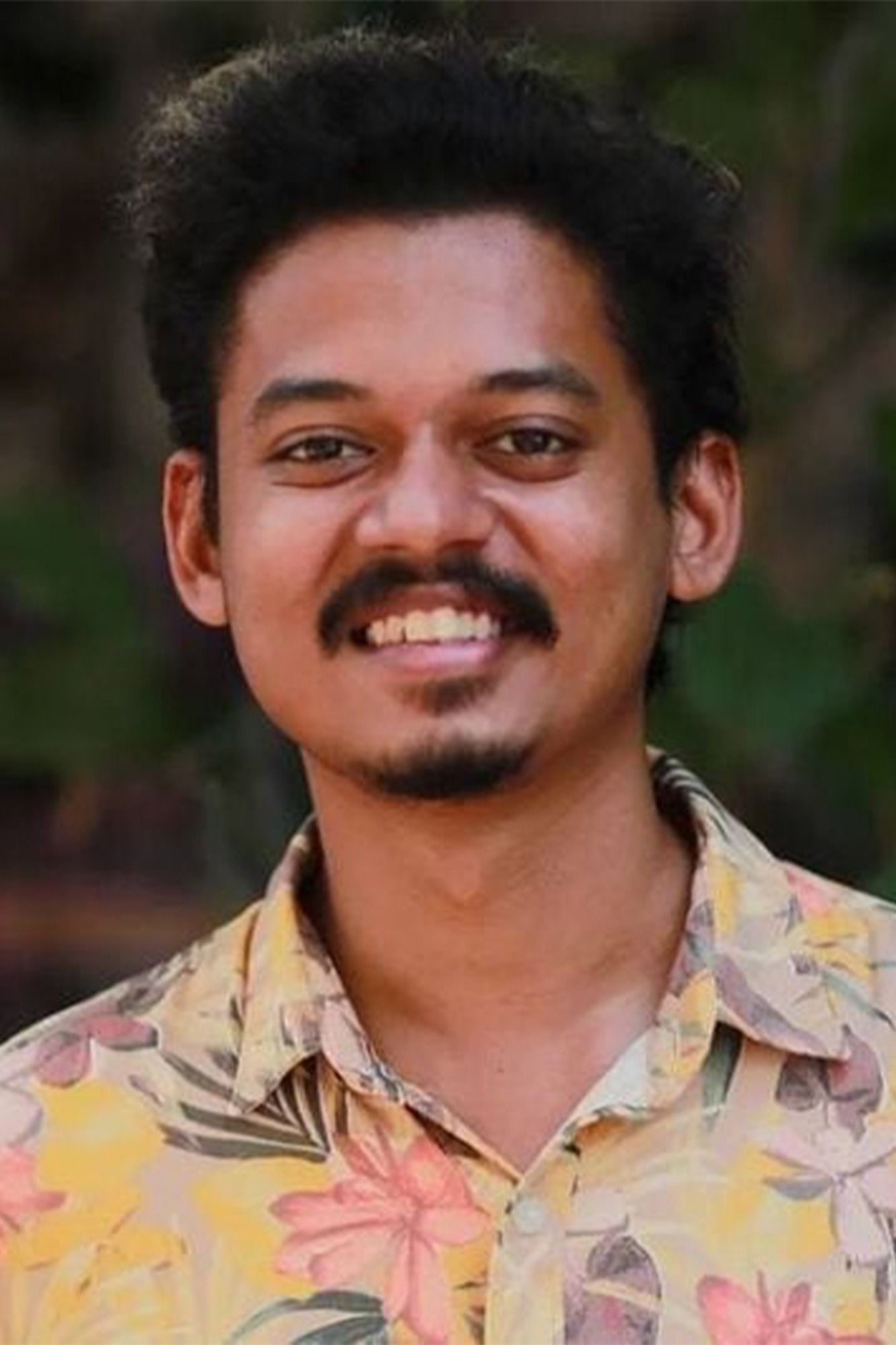 Sangeeth Prathap smiling in a printed shirt, close-up portrait